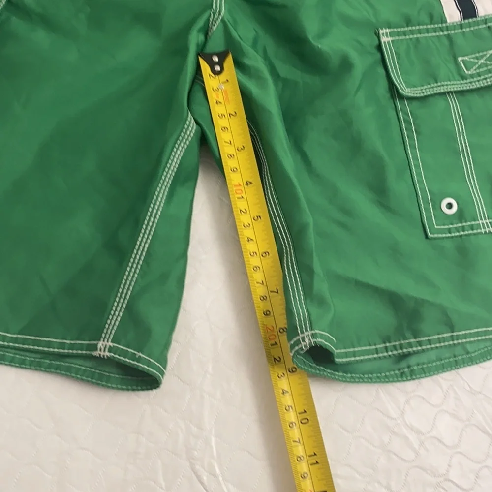 Old Navy green and white swim trunks with pockets